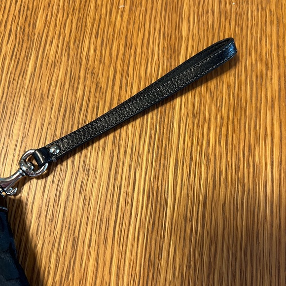 Black Coach clutch with zipper and one inside pocket. - Picture 5 of 9